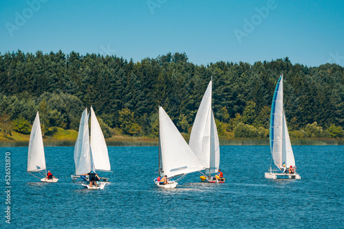 Fototapeta Naklejka Na Ścianę i Meble -  Lots of white boats sailing on the lake