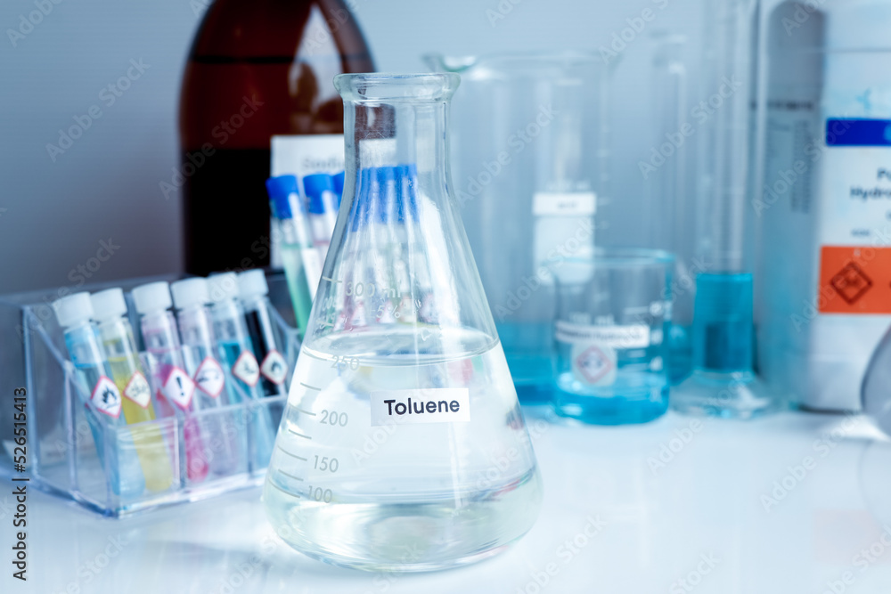 Toluene in glass, chemical in the laboratory Toluene in glass, chemical in the laboratory