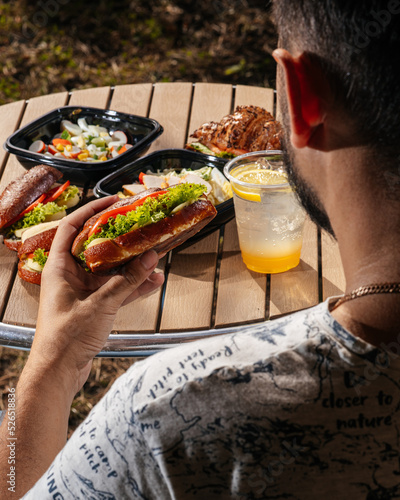 
sandwich with salads and drink on the table