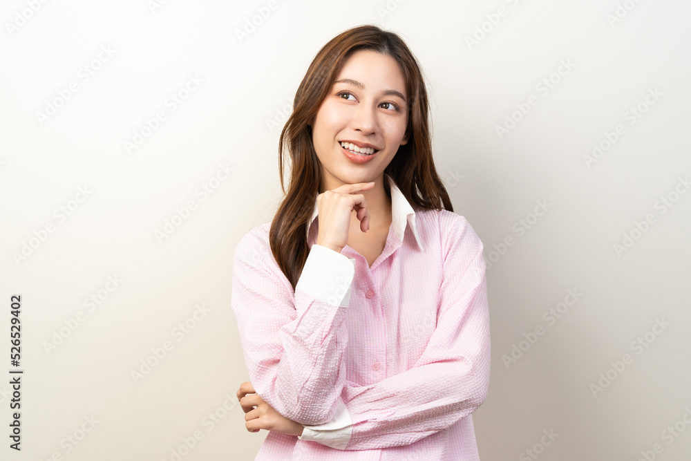 Young female brunette hair thoughtful isolated on background. Young female brunette hair thoughtful isolated on background.