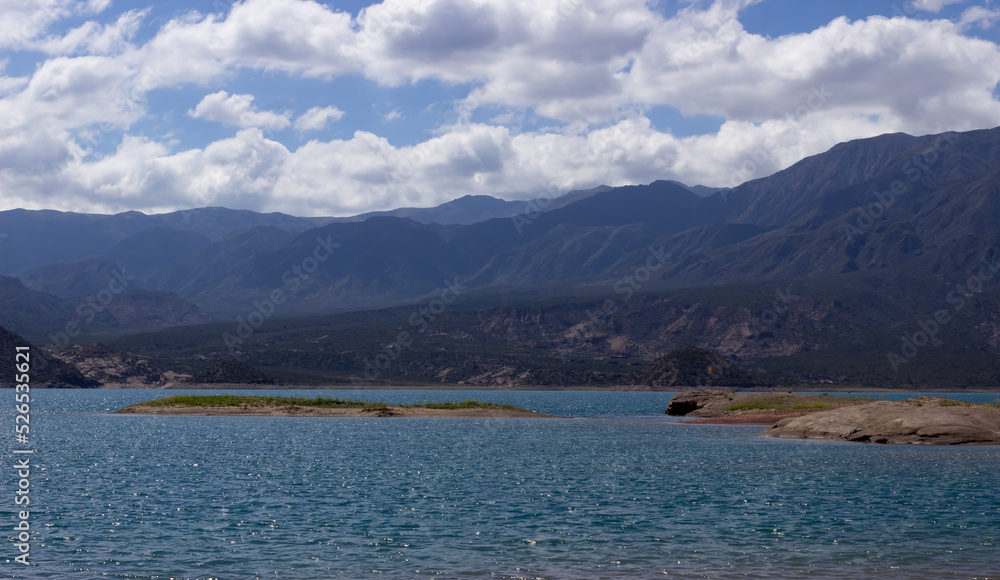 Beautiful scenery with a lake and mountains on a cloudy day.