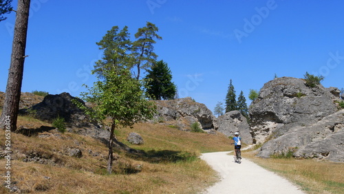 Radfahrerin im Felsenmeer im Wental photo