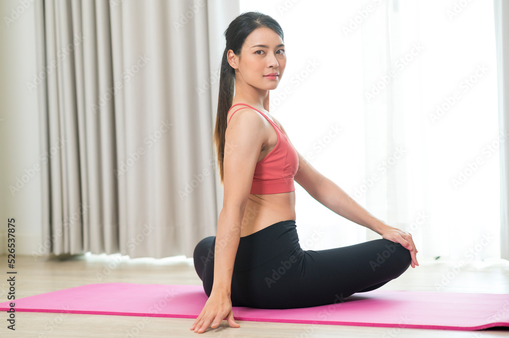 Young and Strong attractive fitness woman in sportswear exercise on yoga mat in gym - Healthy lifestyle training Concept. Young and Strong attractive fitness woman in sportswear exercise on yoga mat in gym - Healthy lifestyle training Concept.