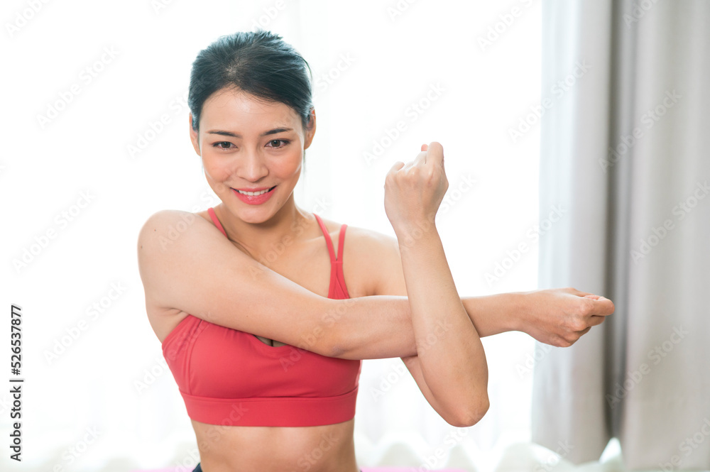 Young and Strong attractive fitness woman in sportswear exercise on yoga mat in gym -  Healthy lifestyle training Concept.