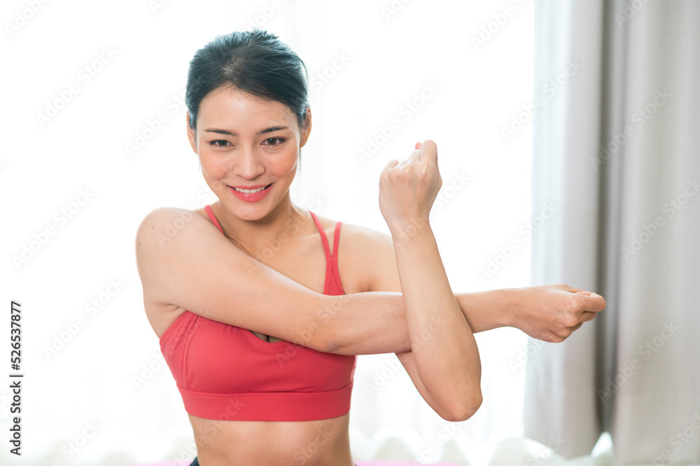 Young and Strong attractive fitness woman in sportswear exercise on yoga mat in gym - Healthy lifestyle training Concept. Young and Strong attractive fitness woman in sportswear exercise on yoga mat in gym - Healthy lifestyle training Concept.