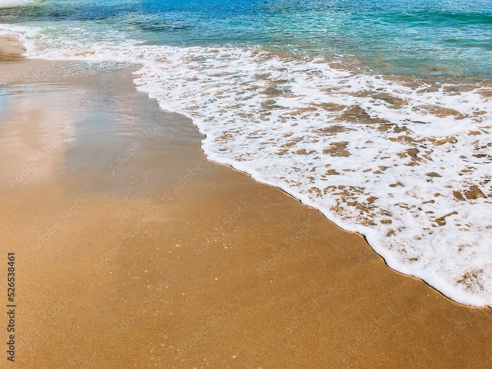 Sea beach foam and blue sea. Concept background beach vacation and tourism