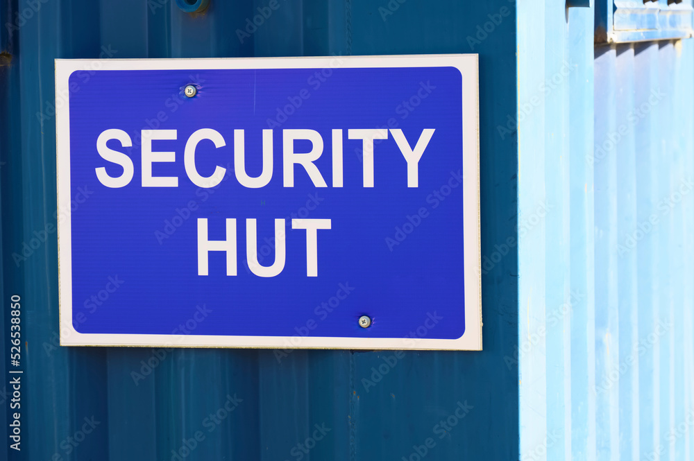 Security hut sign at construction site entrance Security hut sign at construction site entrance