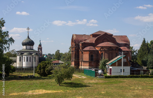 Ancient white-stone St. George's Cathedral in the old town of Yuriev Polsky, Vladimir region, Russia on a clear sunny summer day photo