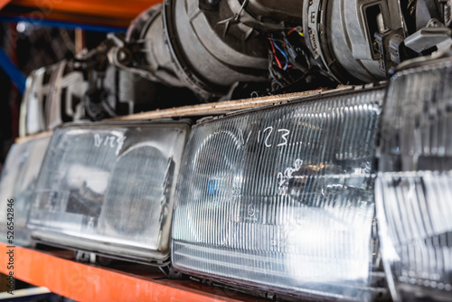 Εκτύπωση καμβά Old secondhand surplus headlight or head lamp assembly parts at an auto parts store