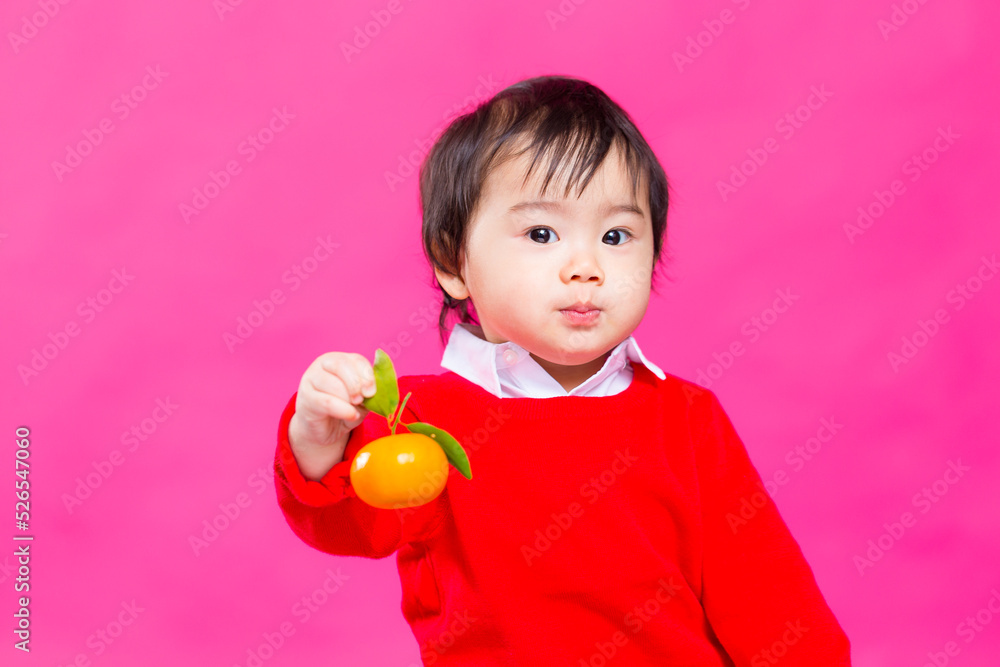 Baby boy holding Citrus for chinese new year Baby boy holding Citrus for chinese new year