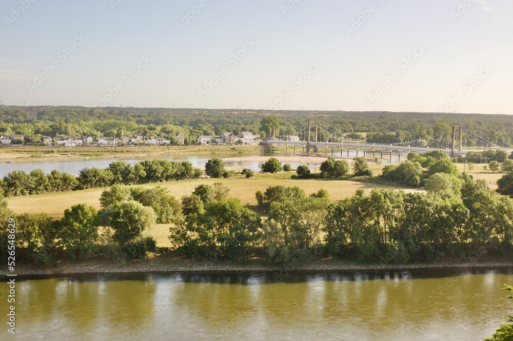 panorama on Loire river with bridge and village in summer time panorama on Loire river with bridge and village in summer time