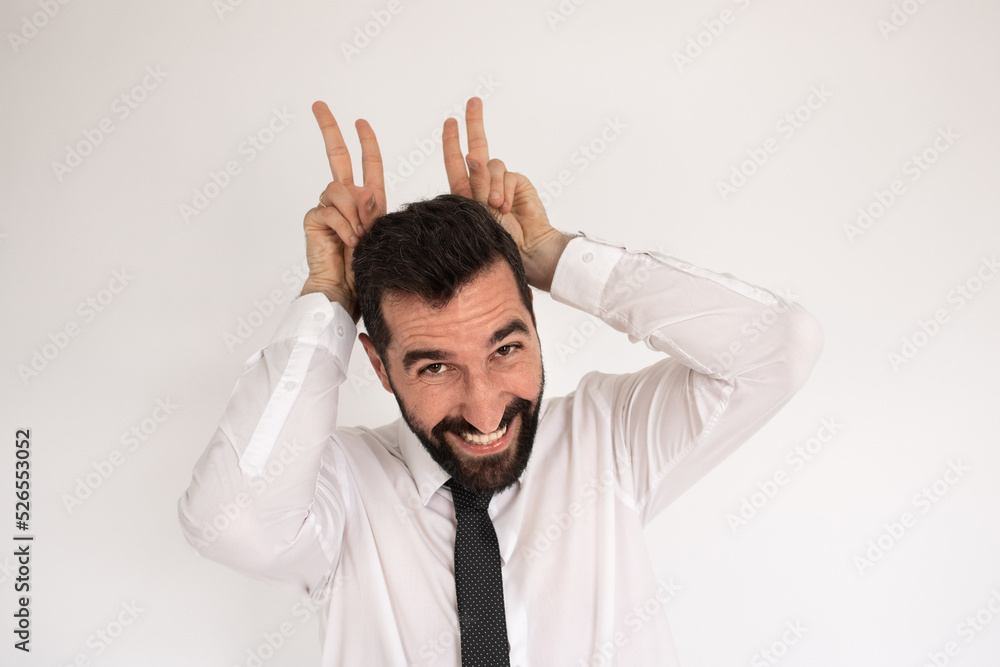 Merry bearded man in studio. Male in shirt and tie gesturing happily, fooling around. Portrait, emotion concept Merry bearded man in studio. Male in shirt and tie gesturing happily, fooling around. Portrait, emotion concept