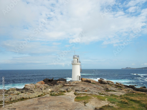 lighthouse between rocks