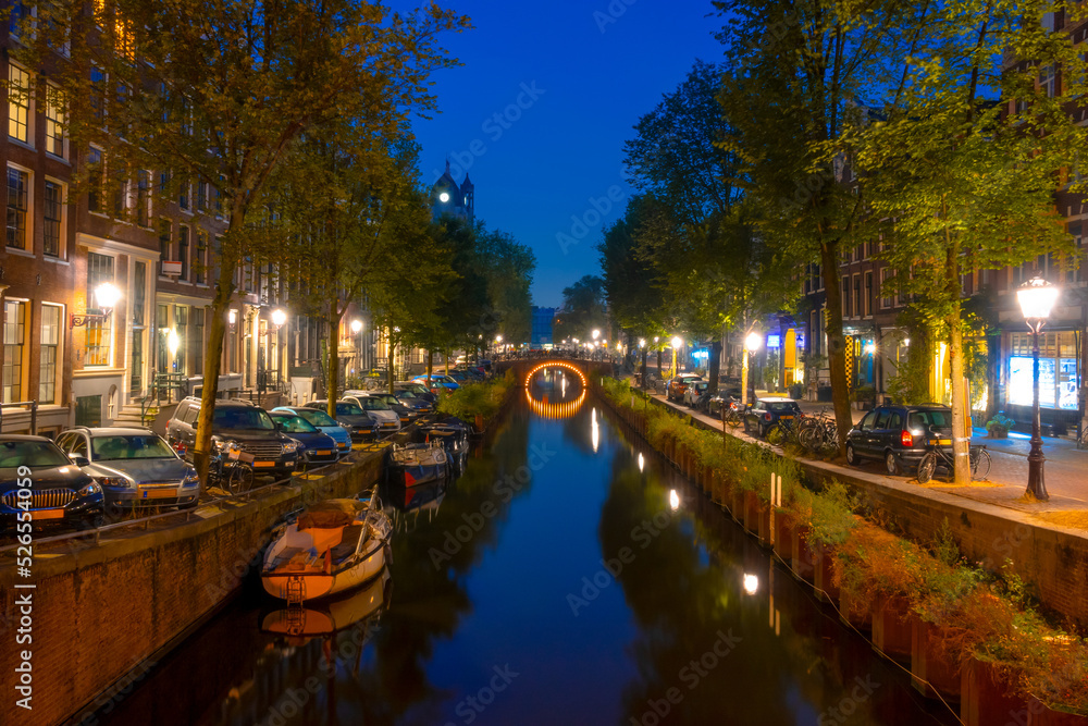 Amsterdam Night Canal With Parked Boats and Cars