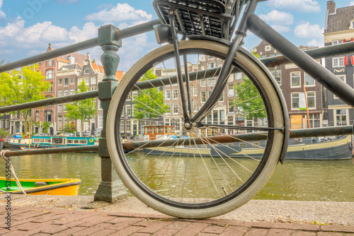 Photography Amsterdam Canal Embankment and Bicycle Wheel