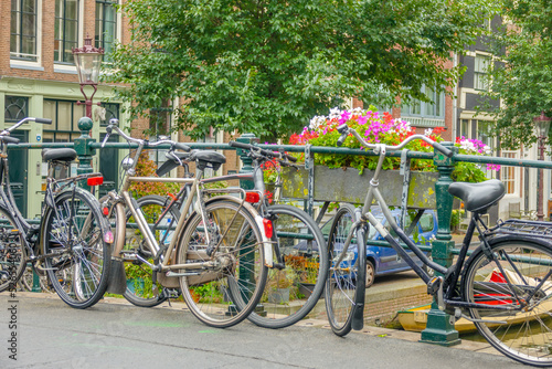 Canvas Print Bicycles and Flowers near the Railing of the Amsterdam Bridge