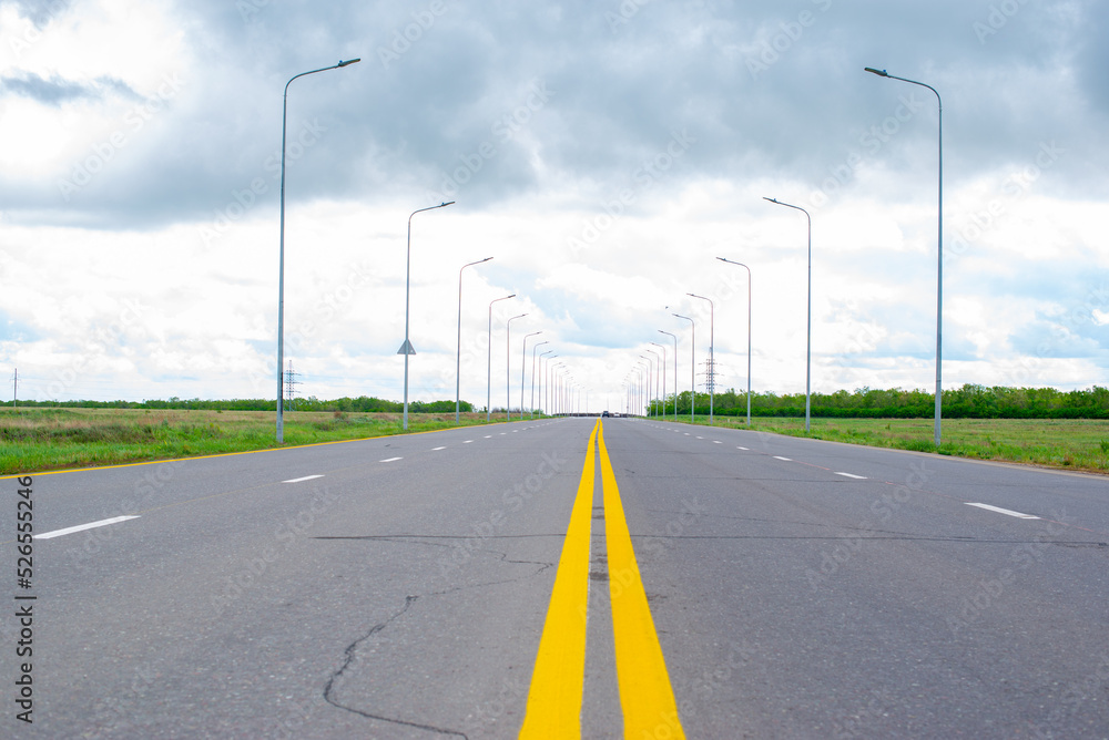 road perspective of paved and sky before rain road perspective of paved and sky before rain