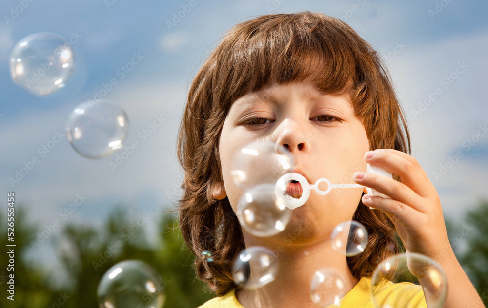 Happy Boy play in bubbles in field sunny summer day. Happy Boy play in bubbles in field sunny summer day.