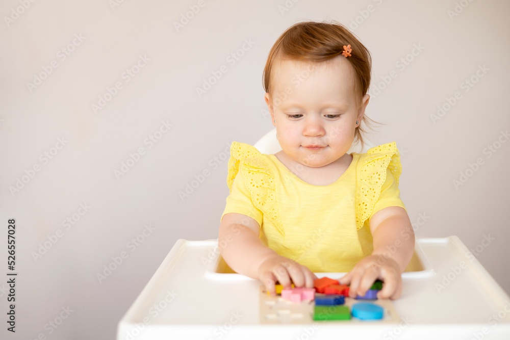 Emotional cute Baby is playing. Infant learning and development. Wooden eco-friendly educational toys. Montessori system. Emotional cute Baby is playing. Infant learning and development. Wooden eco-friendly educational toys. Montessori system.