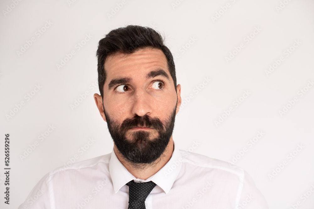 Bearded man making funny face. Male model in suit fooling around. Portrait, emotion concept
