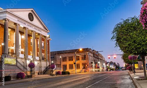 Fototapeta Naklejka Na Ścianę i Meble -  Taillights trails of early morning traffic on Main Street of a small mid west city of Versailles, KY in front of Woodford county courthouse