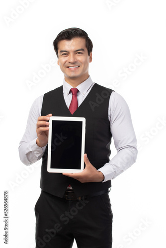 Portrait young businessman working on new tablet, mobile phone in white studio. Portrait of a confident business man in black suit feeling happy and smile holding tablet or mobile phone.