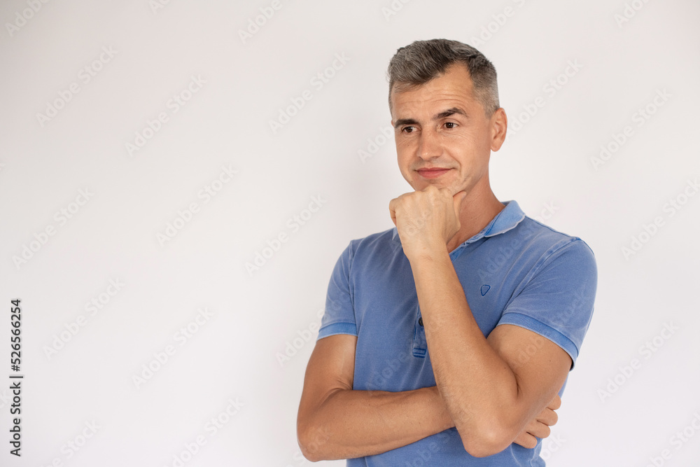 Portrait of serious man. Mid adult male model in T-shirt looking at camera. Portrait, studio shot concept Portrait of serious man. Mid adult male model in T-shirt looking at camera. Portrait, studio shot concept
