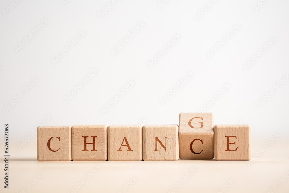 Wooden cube with word change to chance, Personal development and career growth or change yourself concept. Wooden cube with word change to chance, Personal development and career growth or change yourself concept.