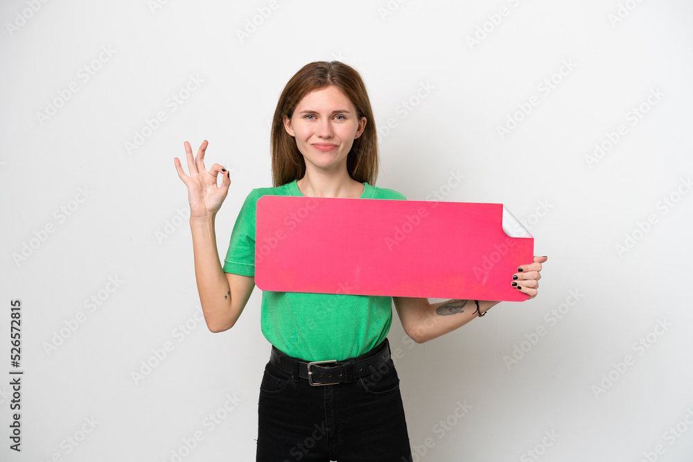 Young English woman isolated on white background holding an empty placard and doing OK sign Young English woman isolated on white background holding an empty placard and doing OK sign