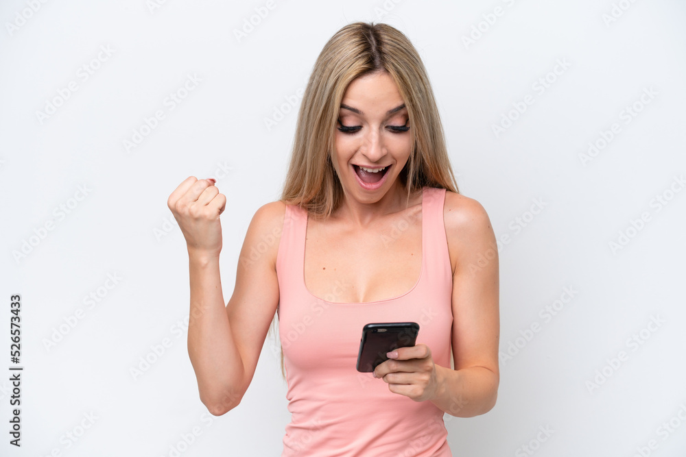Pretty blonde woman isolated on white background surprised and sending a message Pretty blonde woman isolated on white background surprised and sending a message