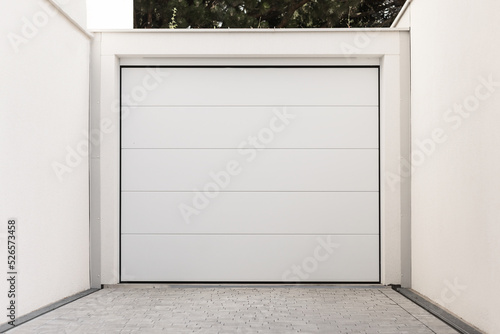 Garage Gate to Private Garage. White Modern Garage Door.