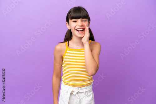 Little caucasian kid isolated on purple background shouting with mouth wide open