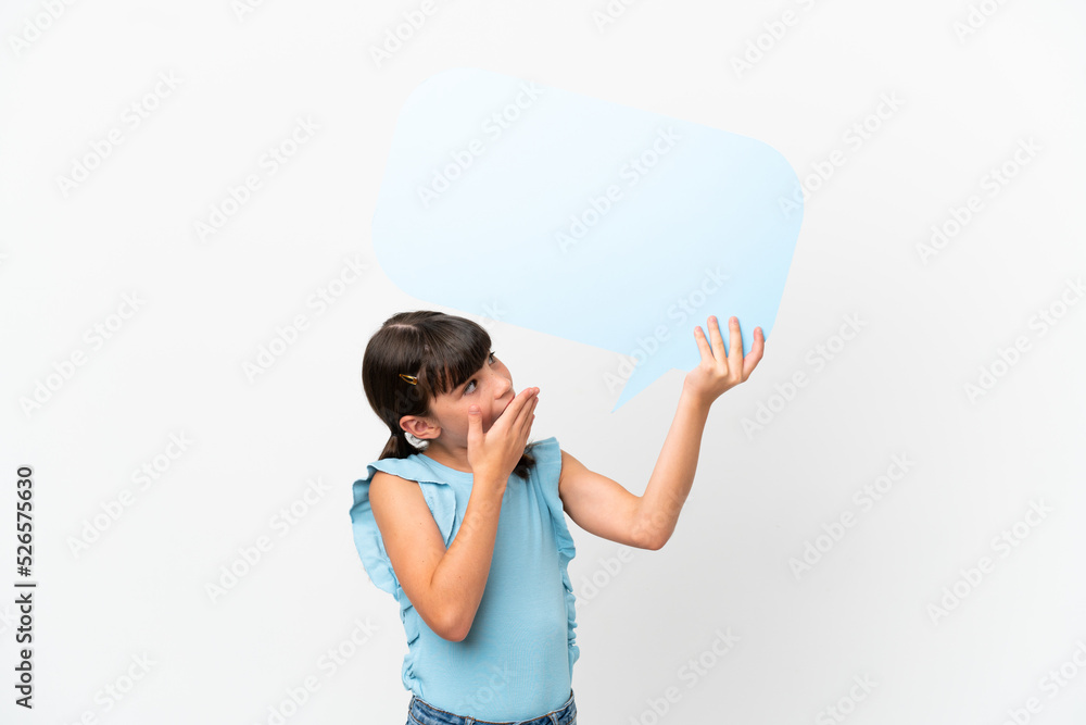 Little caucasian kid isolated on white background holding an empty speech bubble with surprised expression Little caucasian kid isolated on white background holding an empty speech bubble with surprised expression