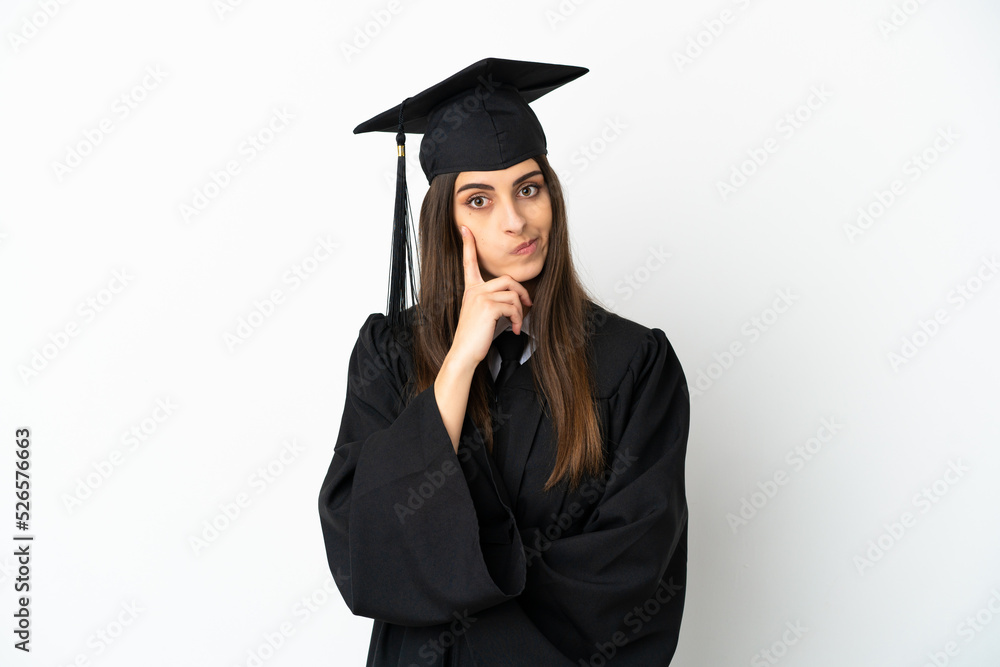 Young university graduate isolated on white background thinking an idea Young university graduate isolated on white background thinking an idea