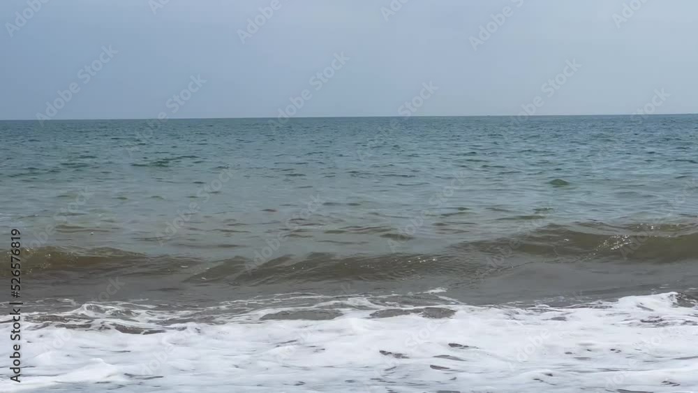 Low angle of the seashore with strong waves near the shore Low angle of the seashore with strong waves near the shore