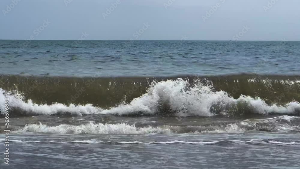 Low angle of the seashore with strong waves near the shore Low angle of the seashore with strong waves near the shore
