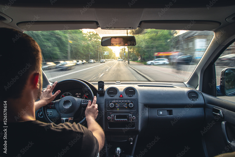 Hands on the wheel when driving at high speed from inside the car. Hands on the wheel when driving at high speed from inside the car.