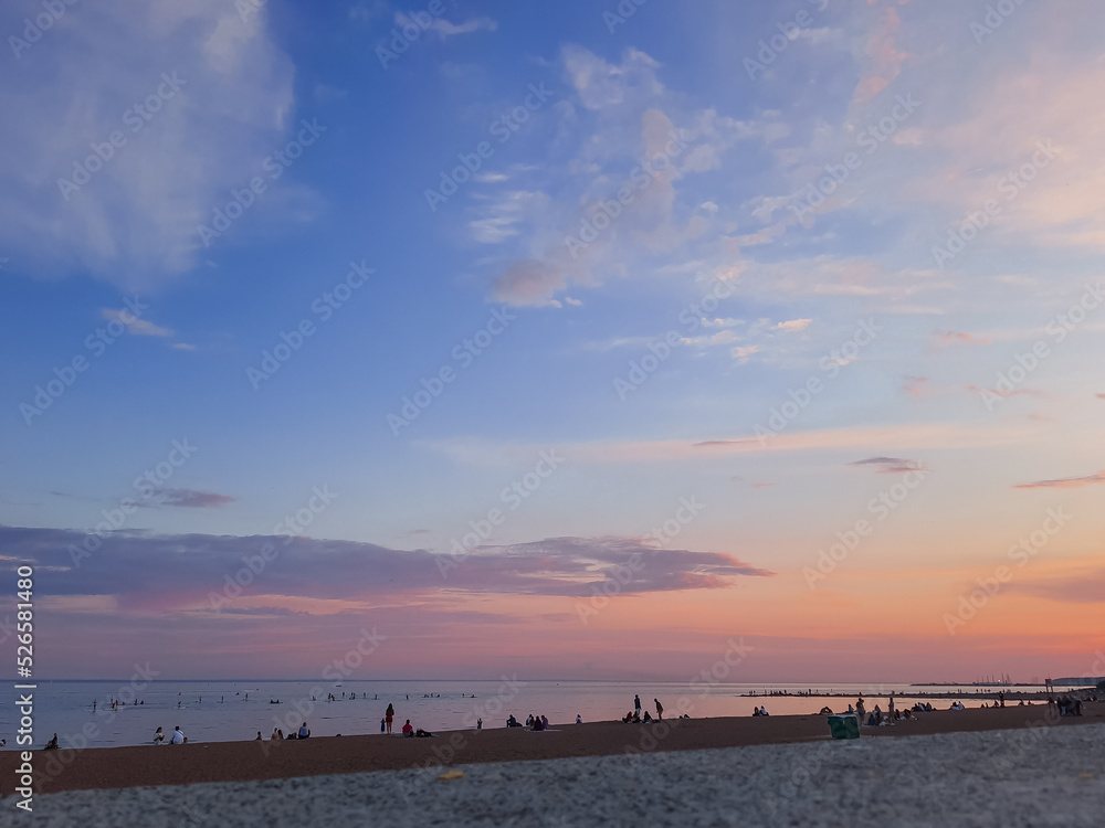 Evening sky over beach, amazing with Colorful Sunset and majestic Sunlight on Twilight ,purple,pink and Blue Nature Dusk Sky Background.cirrus clouds in sunset sky. Atmospheric phenomenon