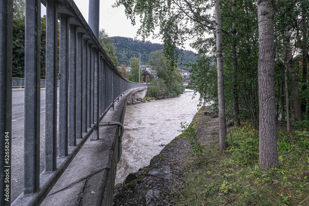 View of Enns river flowing through the town of Schladming, Styria, Austria