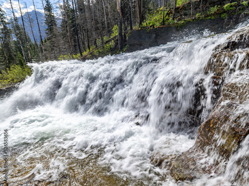 Fototapeta Naklejka Na Ścianę i Meble -  Wild mountain waterfall cascades over rocks