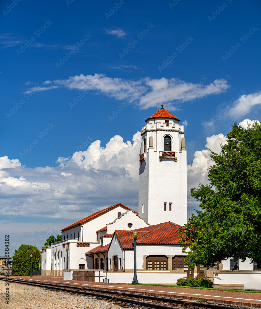 Iconic train depot with blue sky and clouds Iconic train depot with blue sky and clouds