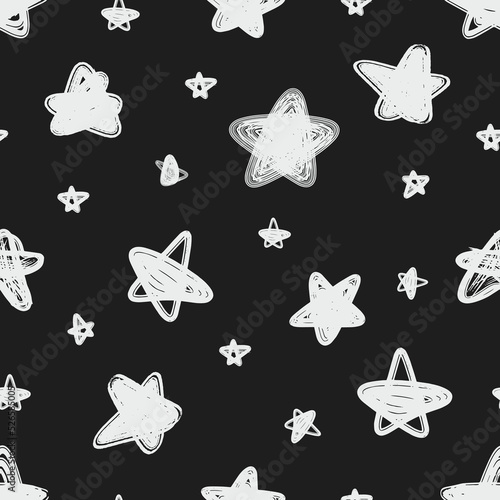 Seamless pattern of abstract hand drawn vector stars on a dark gray background.