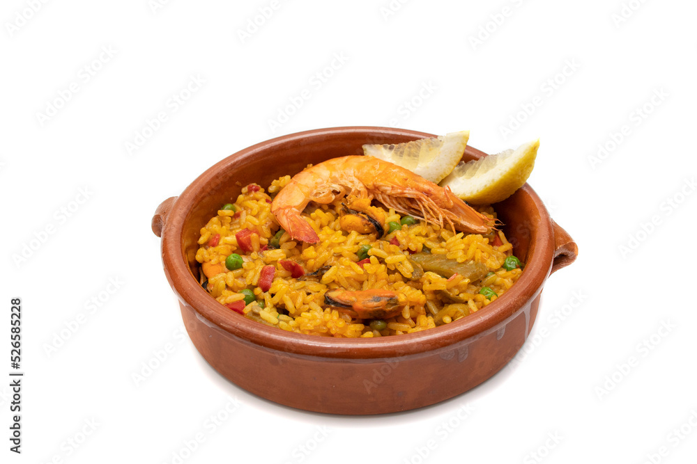 Paella, Seafood Paella in a clay pot, isolated on white background. The