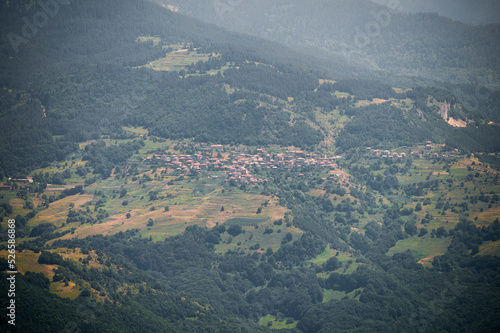 A village far away in the mountain hills sorrounded by forest