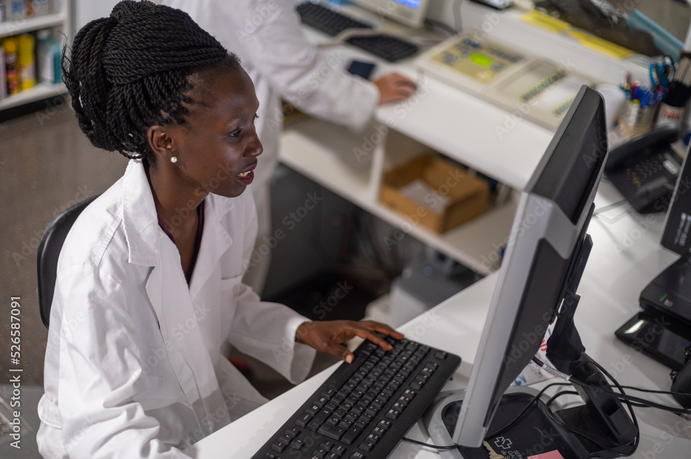 Fototapeta premium Young medical officer working on her computer
