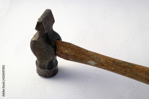 Old wooden hammer. Close up and isolated against a white background.  photo