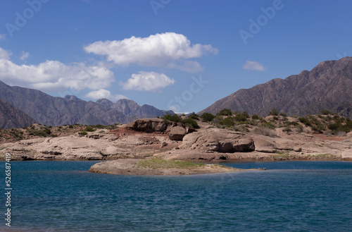 Beautiful scenery with a lake and mountains on a cloudy day.