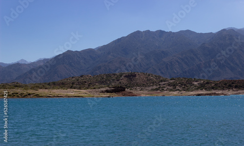 Beautiful scenery with a lake and mountains on a cloudy day.