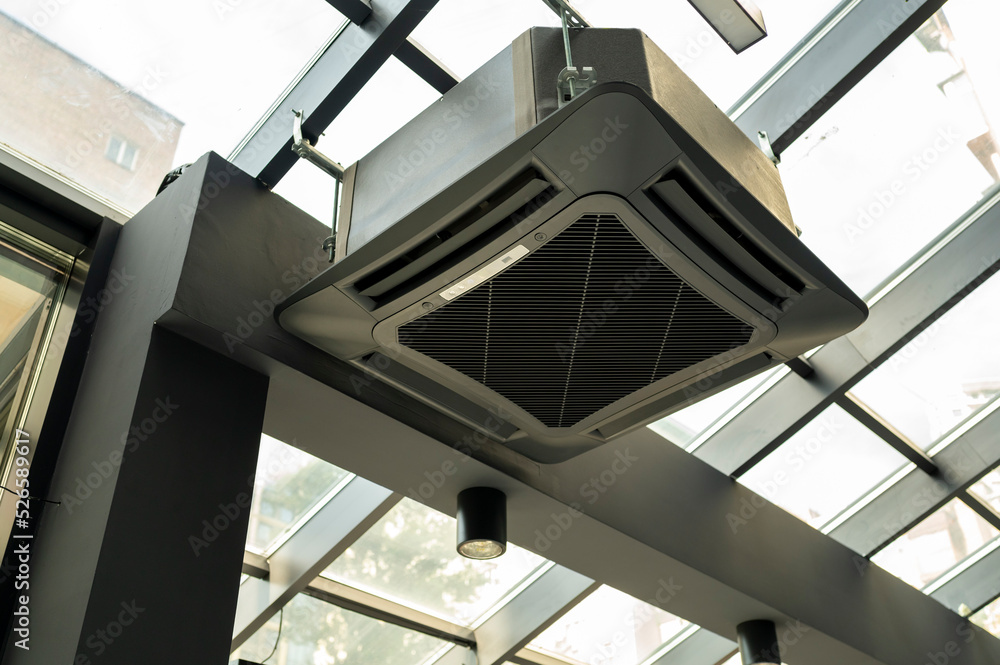 Obraz premium indoor air conditioner housing unit in the office, ventilation system, black case