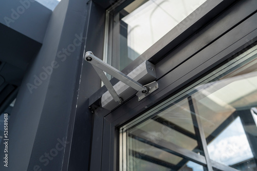 lever door closer in the office for opening and closing the door photo